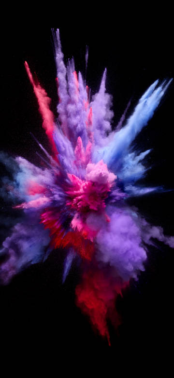 Moment of brilliant powder eruption on a black background