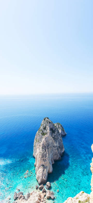 Majestic Rock Island in Blue Sea 4K Phone Wallpaper