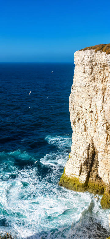 Stunning coastal cliffs blue ocean wallpaper