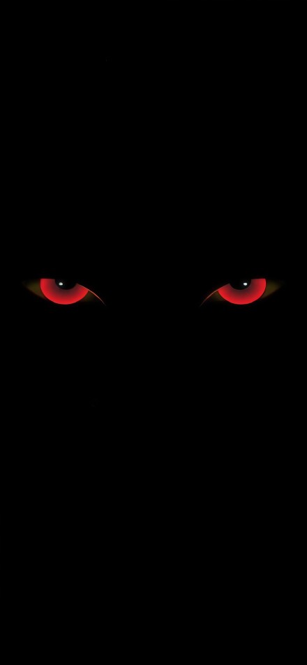 A pair of red eyes on a black background