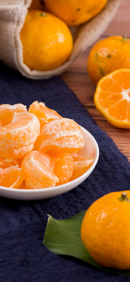 Peeled Tangerines in a Bowl Wallpaper