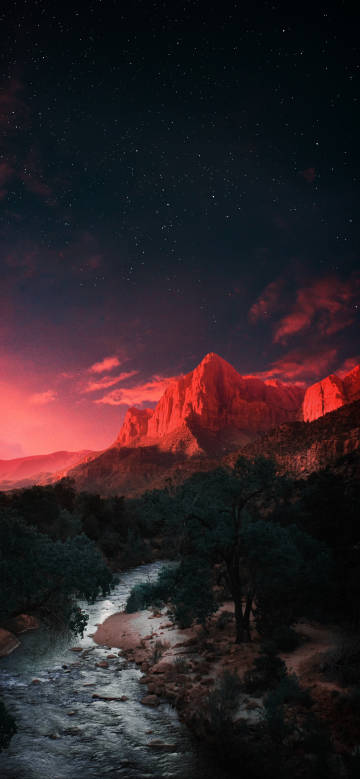 Fantastic night wallpaper: Mountains colored red by the sun under the stars