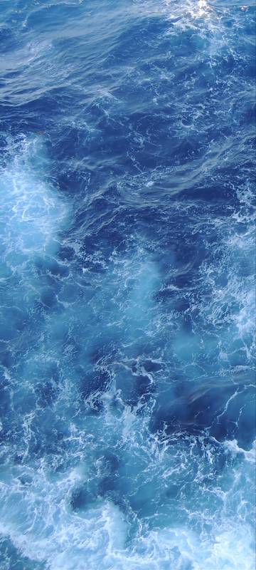 Deep Blue Ocean Water With White Foam