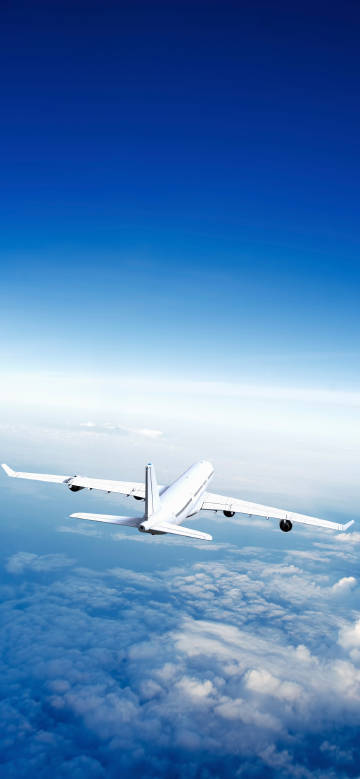 Airplane Flying Above the Clouds 4K Phone Wallpaper