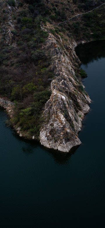 Dark Waters Meet Rugged Cliffs Phone Wallpaper Dark Waters Meet Rugged Cliffs Phone Wallpaper