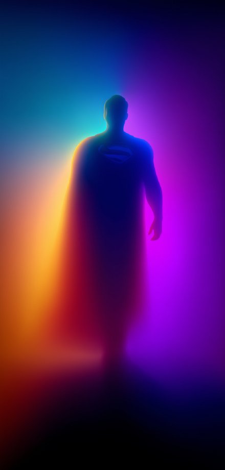 Superman Standing in a Colorful Glow HD Wallpaper