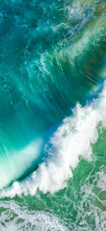 Amazing scene of blue sea and green waves phone wallpaper