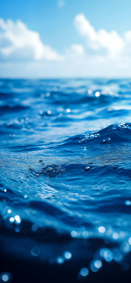 Calm sea blue sky blurred background phone wallpaper