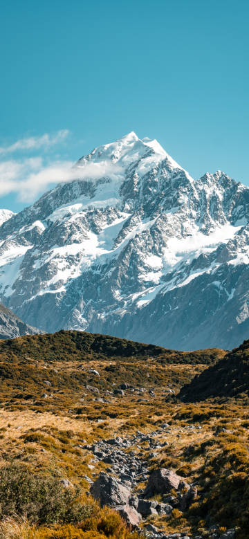 Magnificent scenery of towering snow-capped mountains phone wallpaper