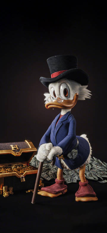 Donald Duck in fancy dress and holding a walking stick