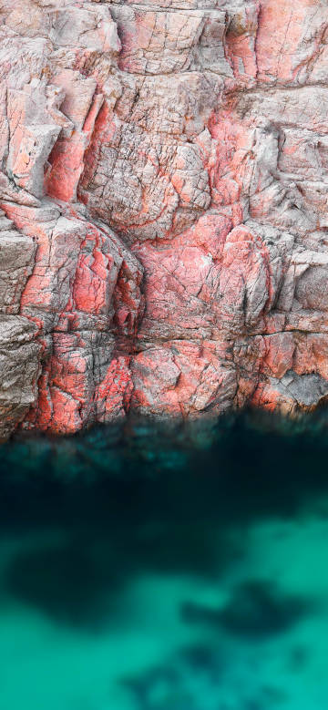 Amazing scene of colored rocks and clear water phone wallpaper