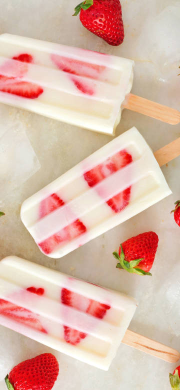 Three delicious strawberry popsicles phone wallpaper