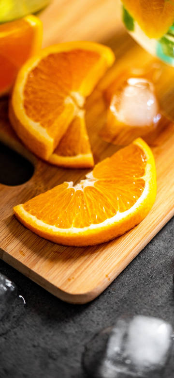 Fresh orange slices close-up phone wallpaper
