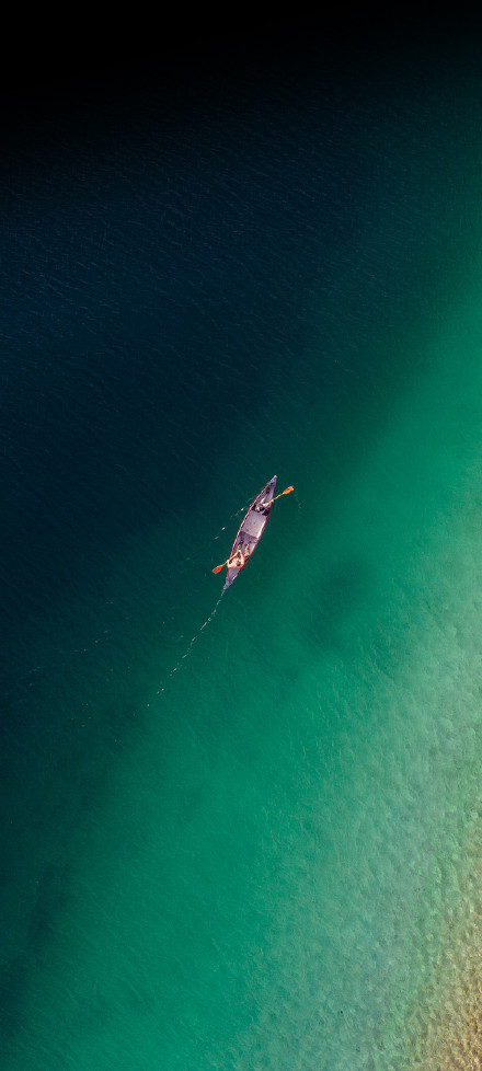 Nubia Z50 Ultra Wallpaper: Canoe on blue-green water