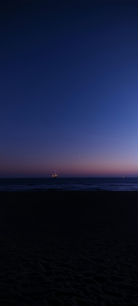 Serene Sea at Dusk with Ships Wallpaper