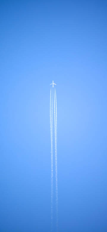 Airplane flying in the clear blue sky phone wallpaper