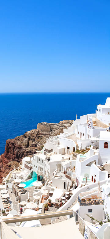 Santorini with blue sea and sky phone wallpaper