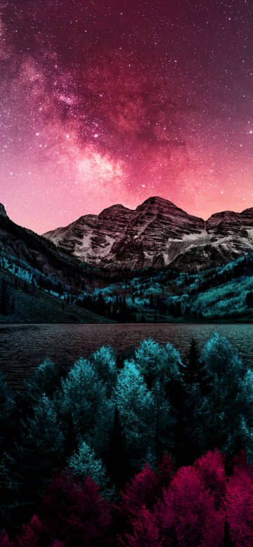 Breathtaking snow-capped mountains under a pink starry sky