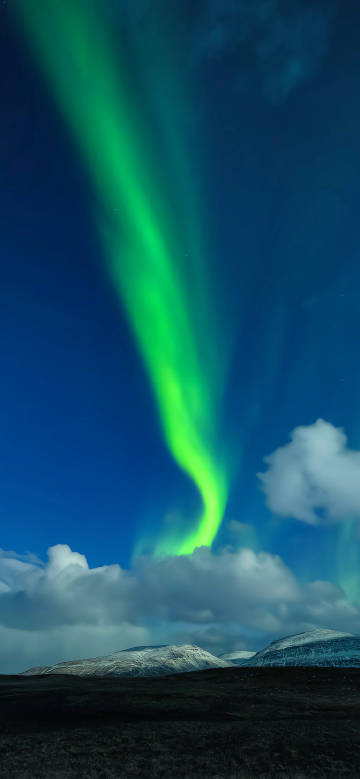 Green aurora dancing like ribbons in the night sky