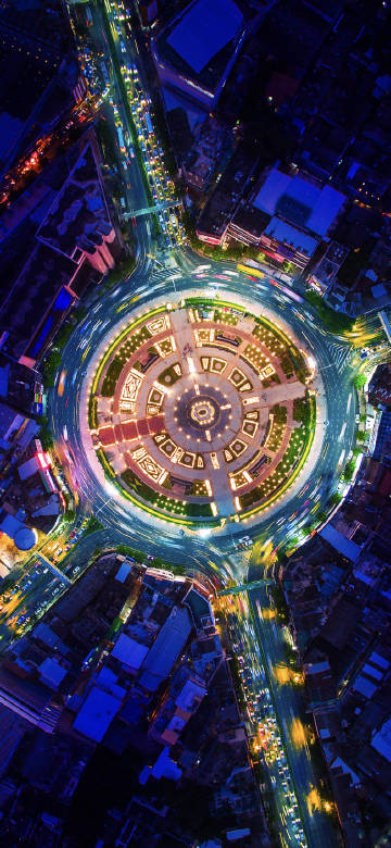 Overlooking the brightly lit city roundabout phone wallpaper