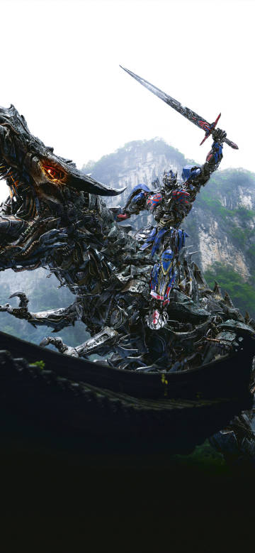 Optimus Prime holding a big sword riding on a mechanical dinosaur