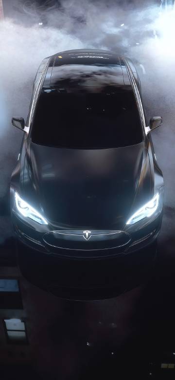Cool Tesla car on black smoke background phone wallpaper