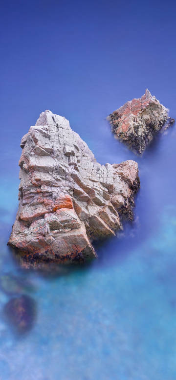 Rocky reefs in clear waters phone wallpaper