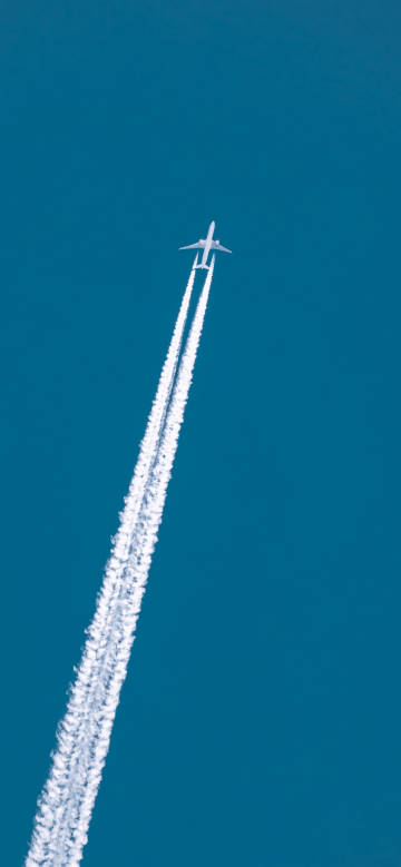 Flying airplane in the blue sky wallpaper