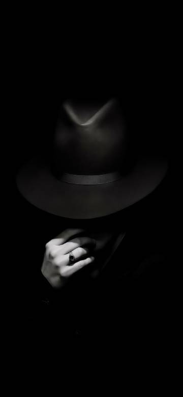 Mysterious hand in black hat phone wallpaper