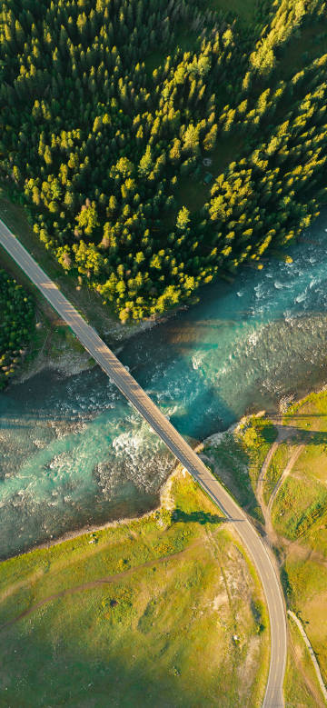 Overlooking the road through the forest and river phone wallpaper