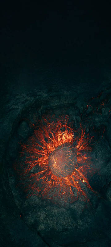 Hot lava flowing on dark rocks phone wallpaper