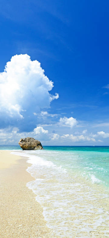 Beach under blue sky and white clouds phone wallpaper