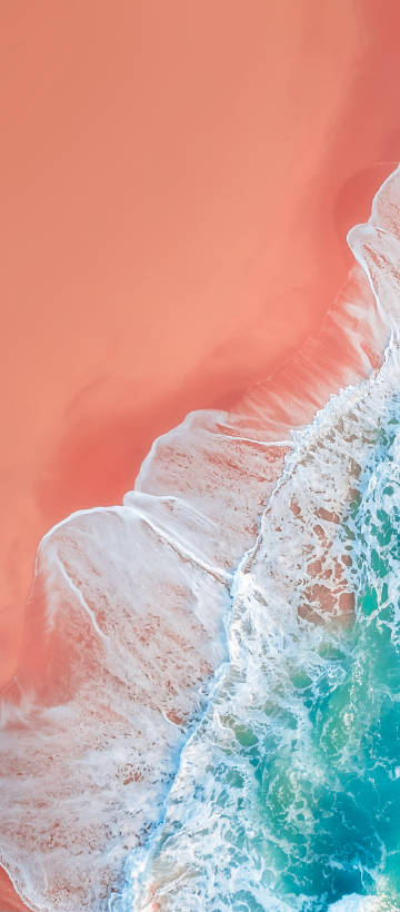 Ocean Waves Crashing on Peach Sand Beach Wallpaper