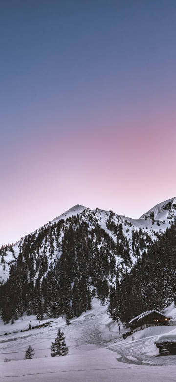 Snow mountain under pink sky