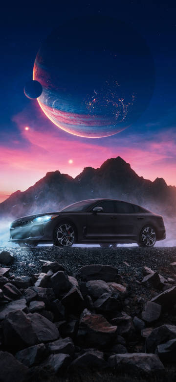 A car under a dreamy starry sky and a huge planet
