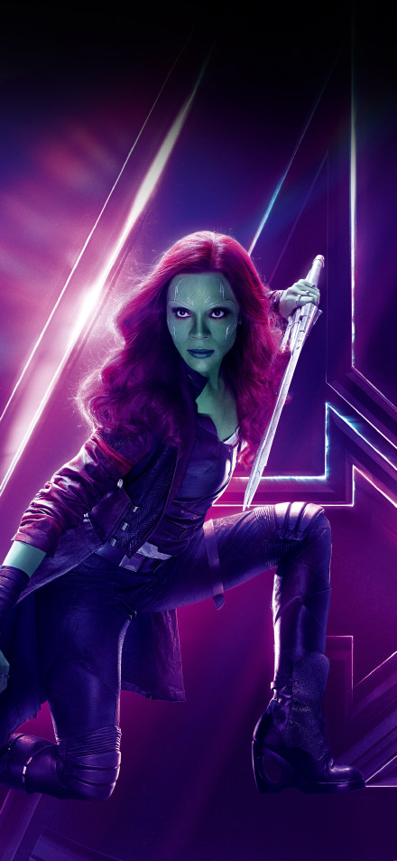 Gamora in combat gear and holding a weapon
