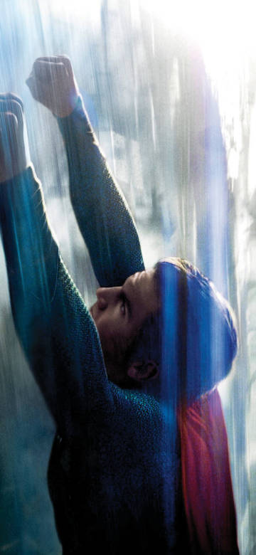 Superman flying into the sky with his arms raised phone wallpaper