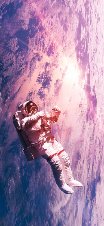 An astronaut floating in space phone wallpaper