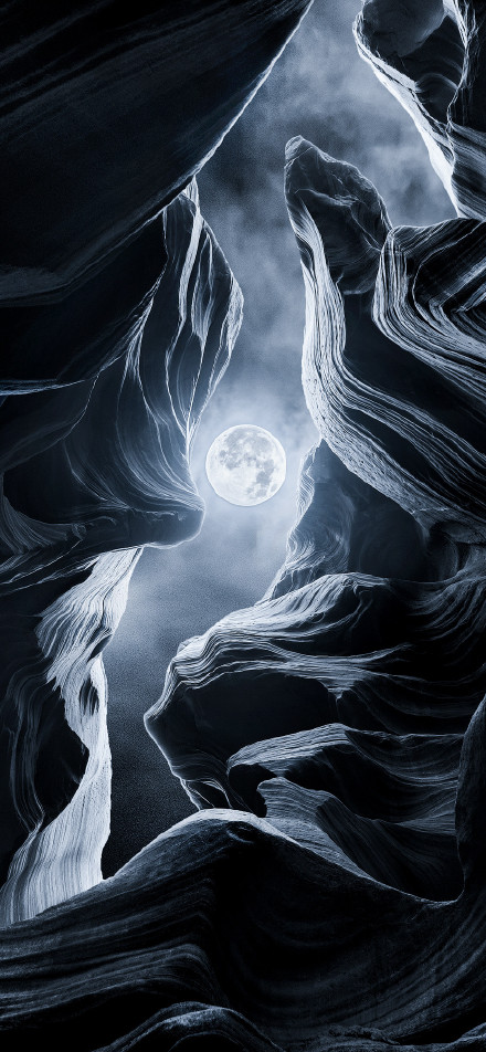 Moon over strange rocks phone wallpaper