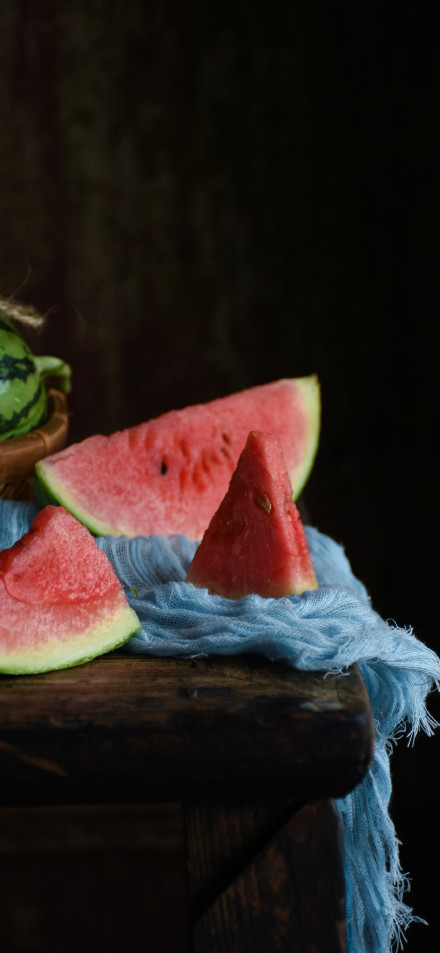 Sliced watermelon on a tabletop 4K wallpaper