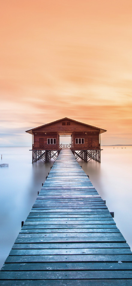 View of the water cabin trestle at sunset phone wallpaper