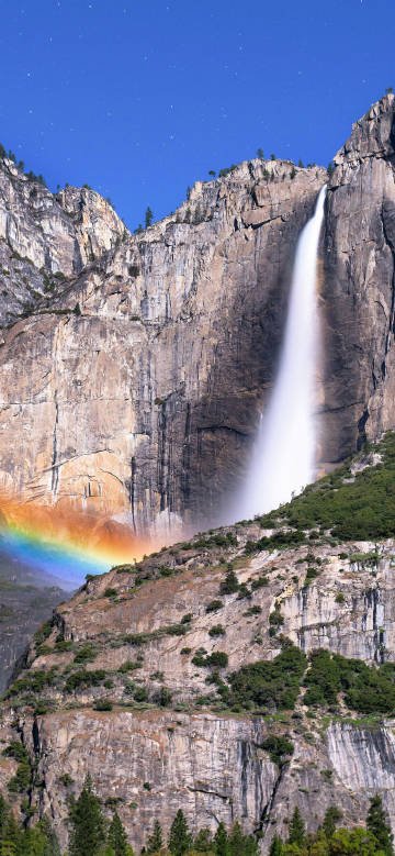 Spectacular view of waterfall and rainbow phone wallpaper