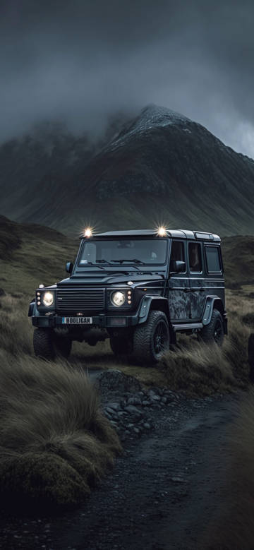 Black Mercedes SUV parked at the foot of the mountain 4K wallpaper