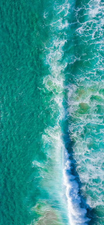Aerial view of ocean waves phone wallpaper