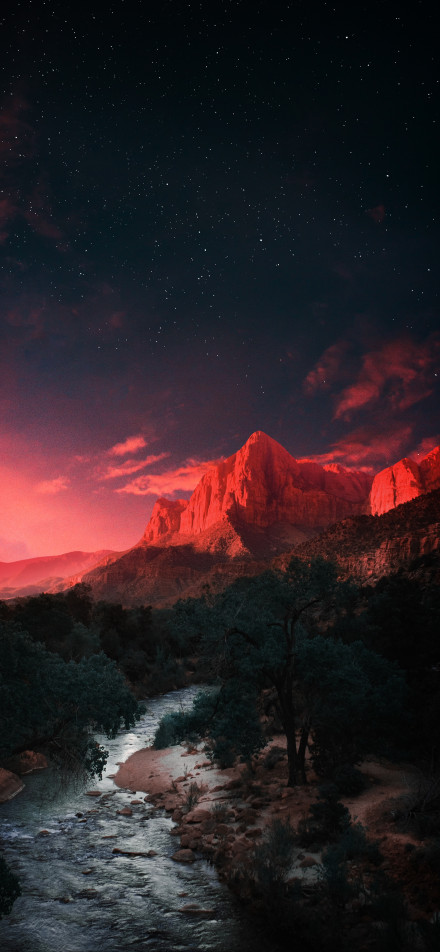 Fantastic night wallpaper: Mountains colored red by the sun under the stars