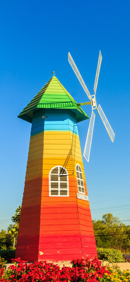 Colorful Rainbow Windmill Under Blue Sky 4K Phone Wallpaper