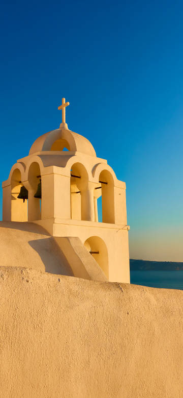 Santorini church bell tower scenery under the sun phone wallpaper