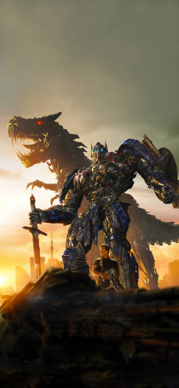 Optimus Prime Standing With A Dragon At Sunset Optimus Prime Standing With A Dragon At Sunset