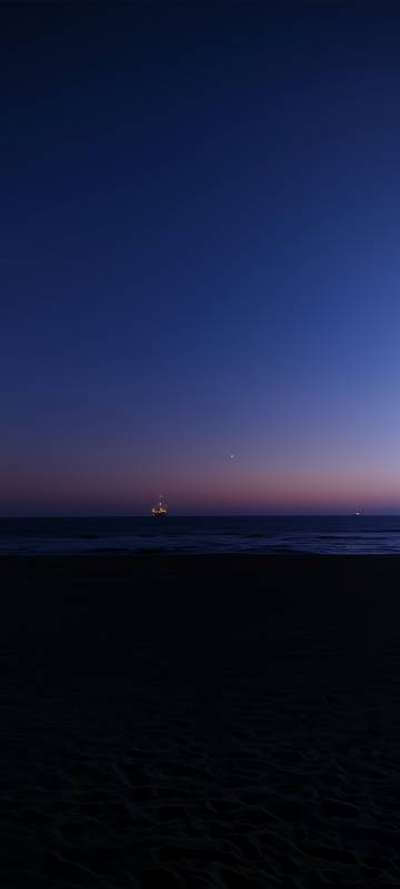 Serene Sea at Dusk with Ships Wallpaper