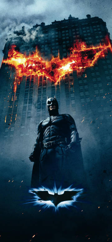 Batman in front of the burning skyscraper phone wallpaper